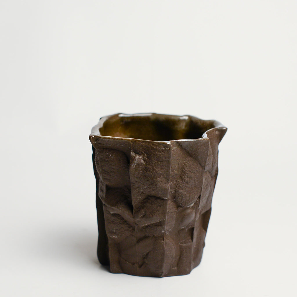 Small porcelain vase handmade by Perth-based ceramicist Annemieke Mulders. Inspired by elements found in nature, Annemieke predominantly works with slipcasting techniques to create contemporary ceramics with interesting forms and tactile surfaces using fine porcelain and stoneware clays.