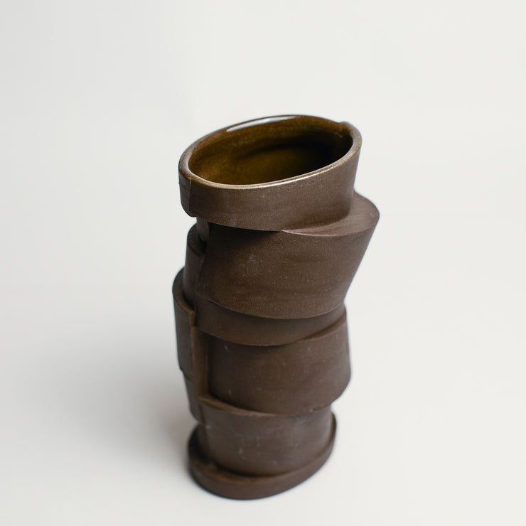 Small porcelain vase handmade by Perth-based ceramicist Annemieke Mulders. Inspired by elements found in nature, Annemieke predominantly works with slipcasting techniques to create contemporary ceramics with interesting forms and tactile surfaces using fine porcelain and stoneware clays.