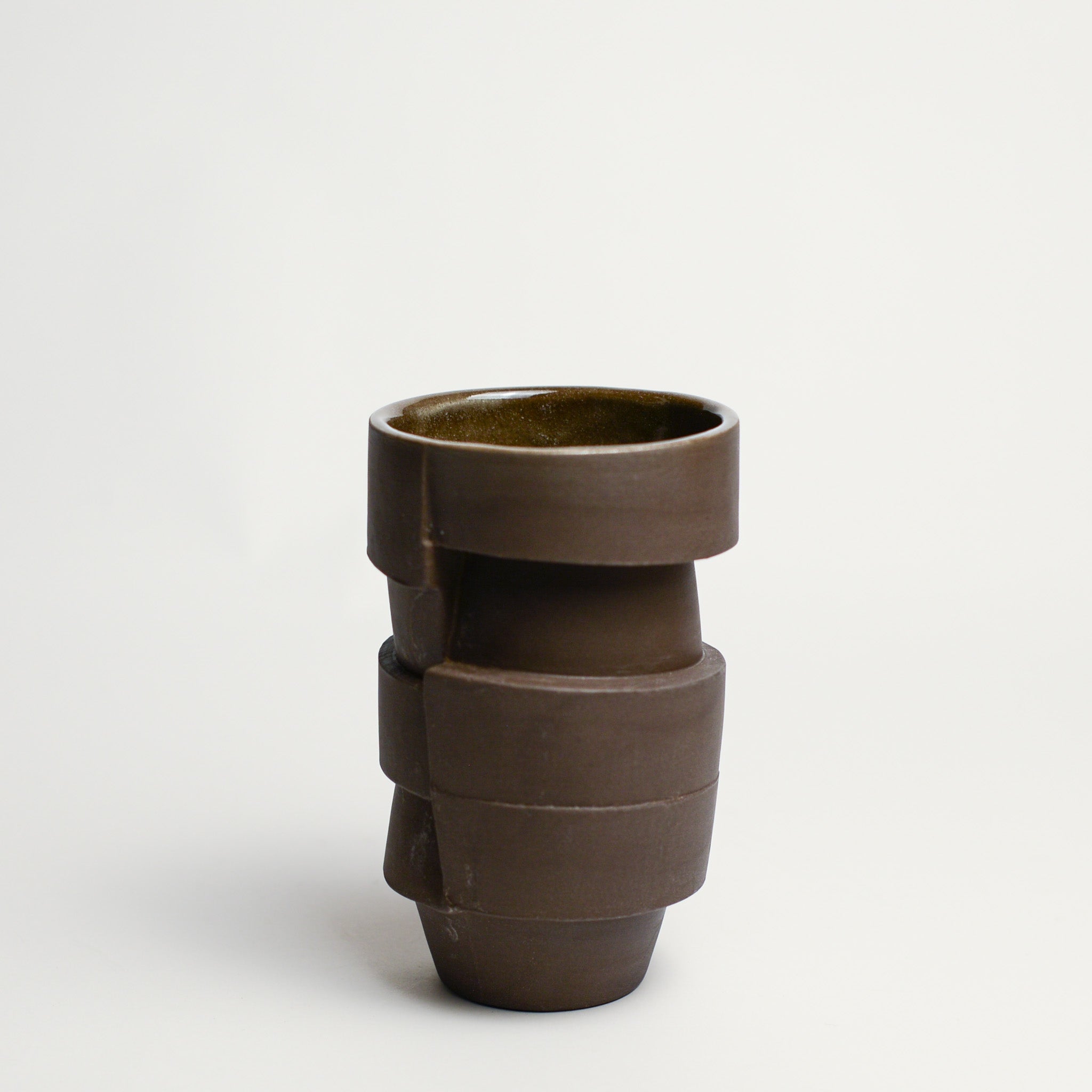 Small porcelain vase handmade by Perth-based ceramicist Annemieke Mulders. Inspired by elements found in nature, Annemieke predominantly works with slipcasting techniques to create contemporary ceramics with interesting forms and tactile surfaces using fine porcelain and stoneware clays.