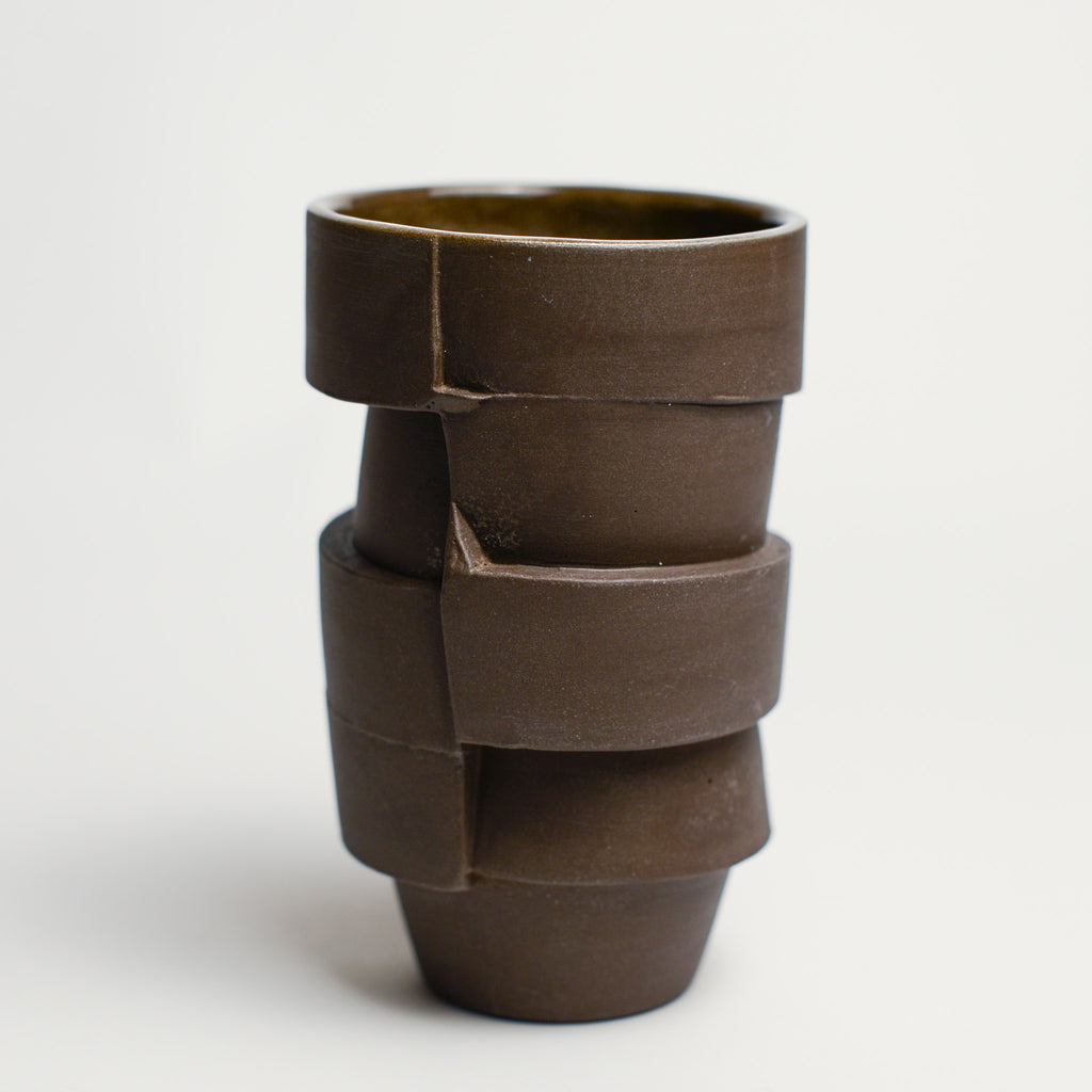 Small porcelain vase handmade by Perth-based ceramicist Annemieke Mulders. Inspired by elements found in nature, Annemieke predominantly works with slipcasting techniques to create contemporary ceramics with interesting forms and tactile surfaces using fine porcelain and stoneware clays.