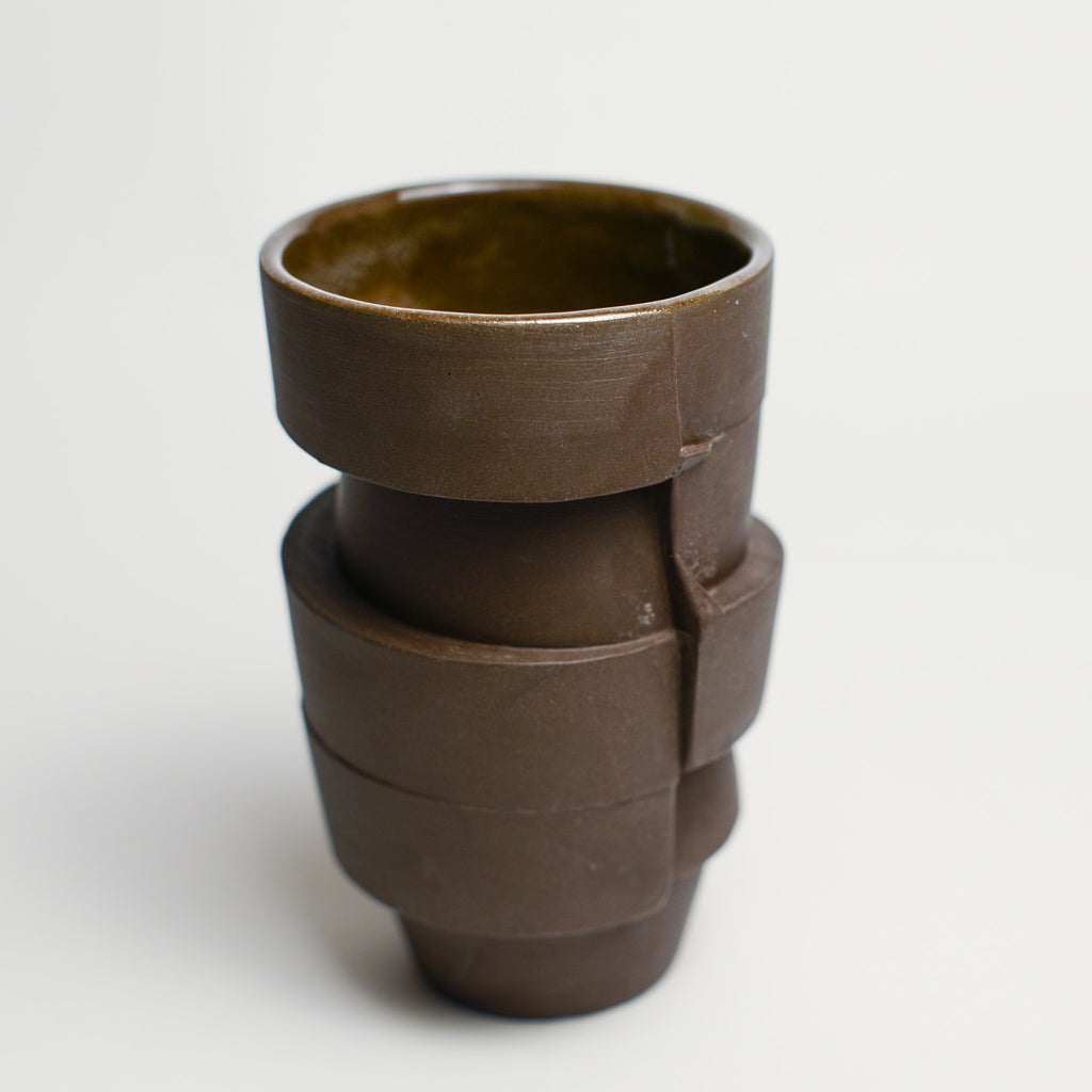 Small porcelain vase handmade by Perth-based ceramicist Annemieke Mulders. Inspired by elements found in nature, Annemieke predominantly works with slipcasting techniques to create contemporary ceramics with interesting forms and tactile surfaces using fine porcelain and stoneware clays.