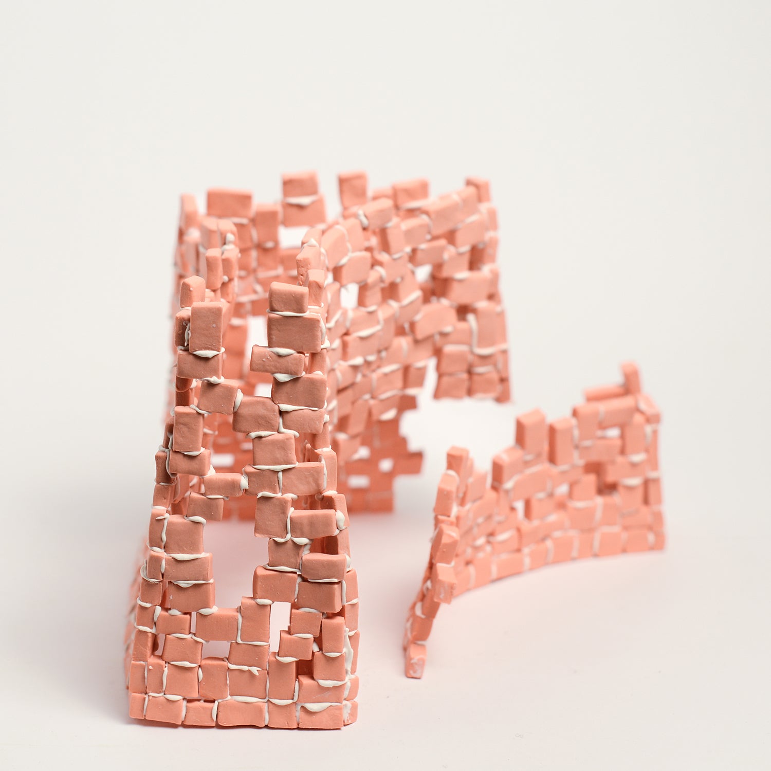 Tatt’s interest in New Materialist theories informs the technique of assembling multiple porcelain tesserae or cut and refined ceramic tiles. The physicality of individual assemblage of tesserae creates abstract forms of balance and precarity, layers, stacks, pattern and negative spaces. Using hyper focusing as a perceptive and making strategy, concentrating on the individual tesserae tile she considers their relationship and action with other objects and the surrounding environment.