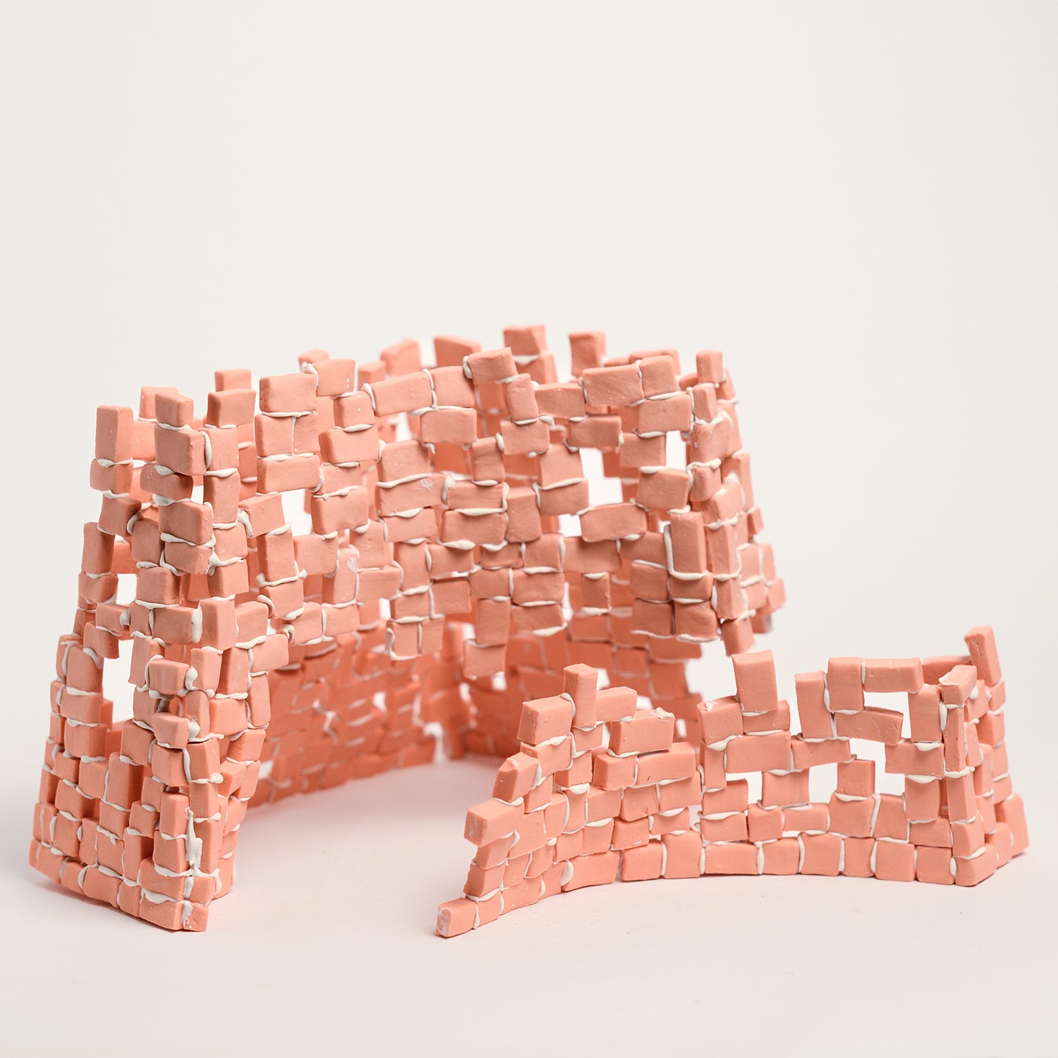 Tatt’s interest in New Materialist theories informs the technique of assembling multiple porcelain tesserae or cut and refined ceramic tiles. The physicality of individual assemblage of tesserae creates abstract forms of balance and precarity, layers, stacks, pattern and negative spaces. Using hyper focusing as a perceptive and making strategy, concentrating on the individual tesserae tile she considers their relationship and action with other objects and the surrounding environment.