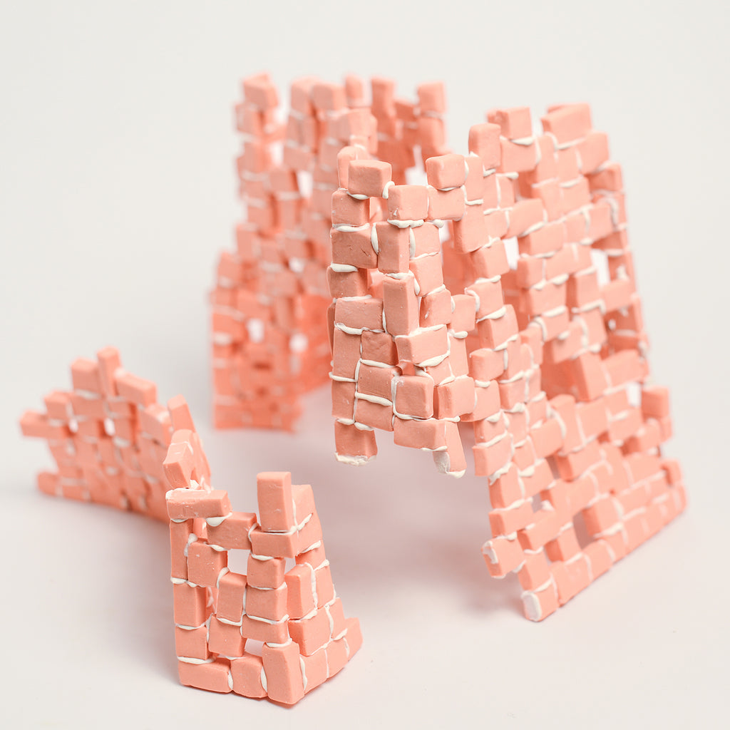 Tatt’s interest in New Materialist theories informs the technique of assembling multiple porcelain tesserae or cut and refined ceramic tiles. The physicality of individual assemblage of tesserae creates abstract forms of balance and precarity, layers, stacks, pattern and negative spaces. Using hyper focusing as a perceptive and making strategy, concentrating on the individual tesserae tile she considers their relationship and action with other objects and the surrounding environment.