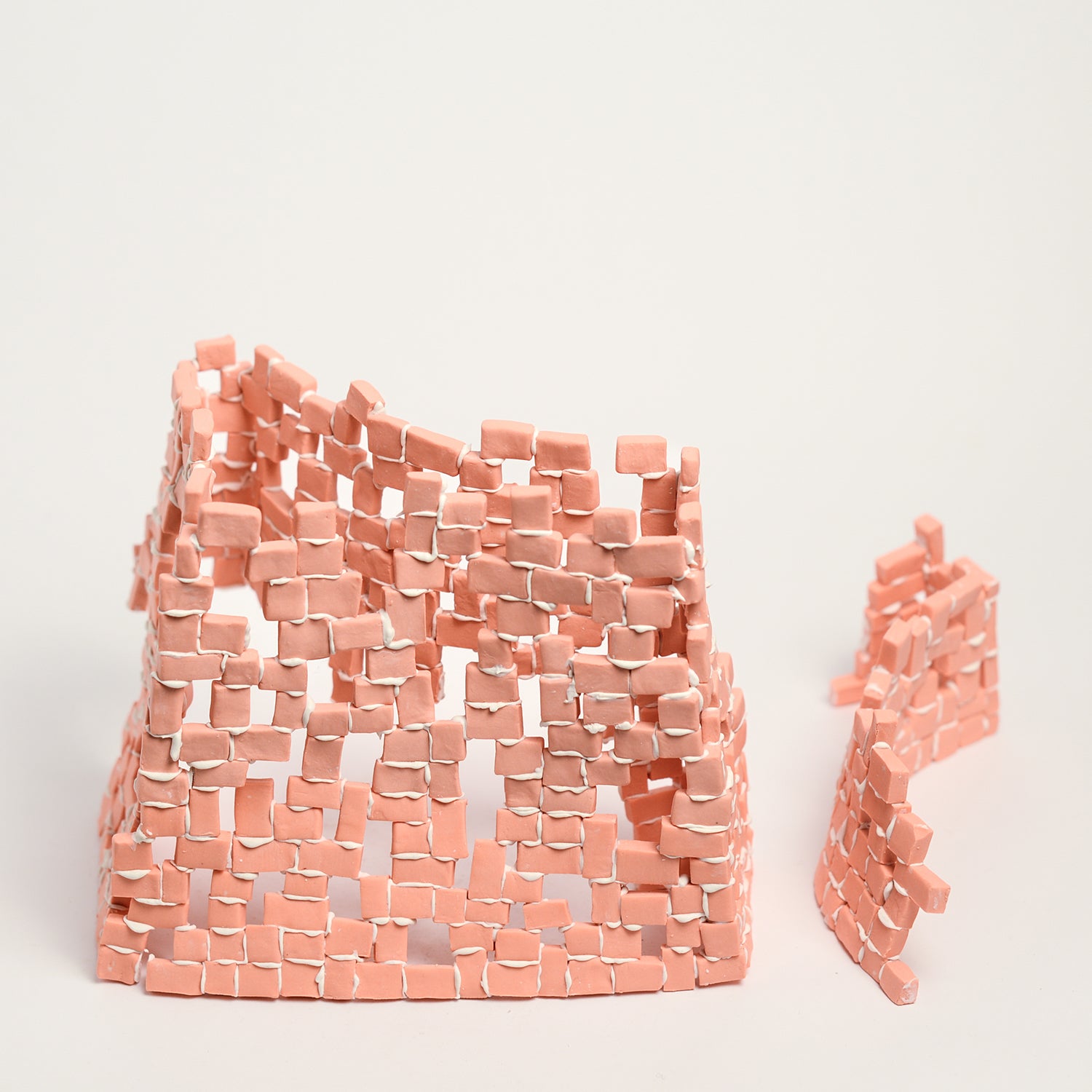 Tatt’s interest in New Materialist theories informs the technique of assembling multiple porcelain tesserae or cut and refined ceramic tiles. The physicality of individual assemblage of tesserae creates abstract forms of balance and precarity, layers, stacks, pattern and negative spaces. Using hyper focusing as a perceptive and making strategy, concentrating on the individual tesserae tile she considers their relationship and action with other objects and the surrounding environment.