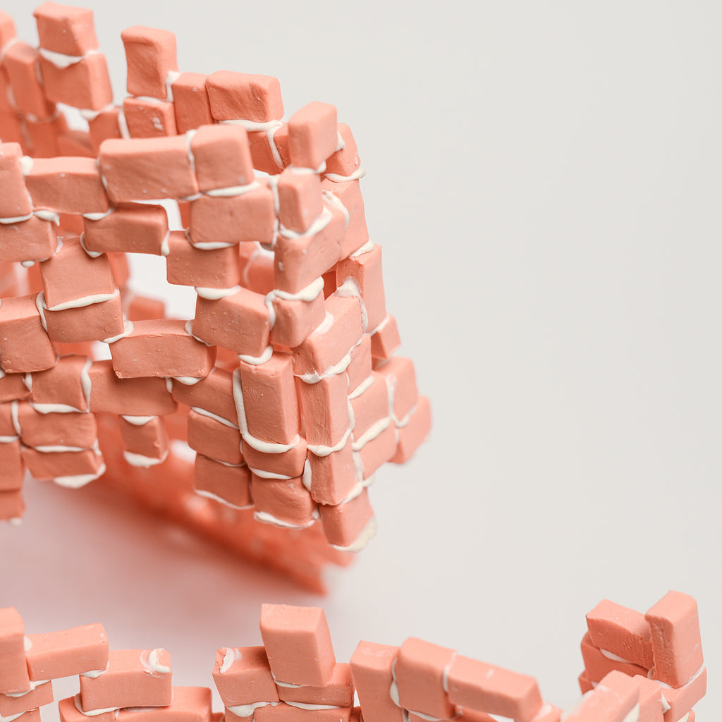 Tatt’s interest in New Materialist theories informs the technique of assembling multiple porcelain tesserae or cut and refined ceramic tiles. The physicality of individual assemblage of tesserae creates abstract forms of balance and precarity, layers, stacks, pattern and negative spaces. Using hyper focusing as a perceptive and making strategy, concentrating on the individual tesserae tile she considers their relationship and action with other objects and the surrounding environment.