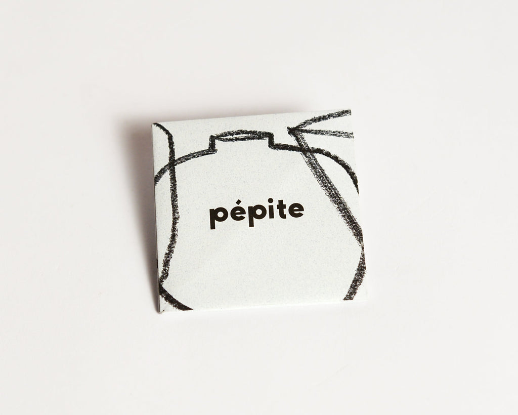 pépite origami-style gift card in its folded form, featuring a minimalist design with a black crayon-style graphic and 'pépite' logo on the front.
