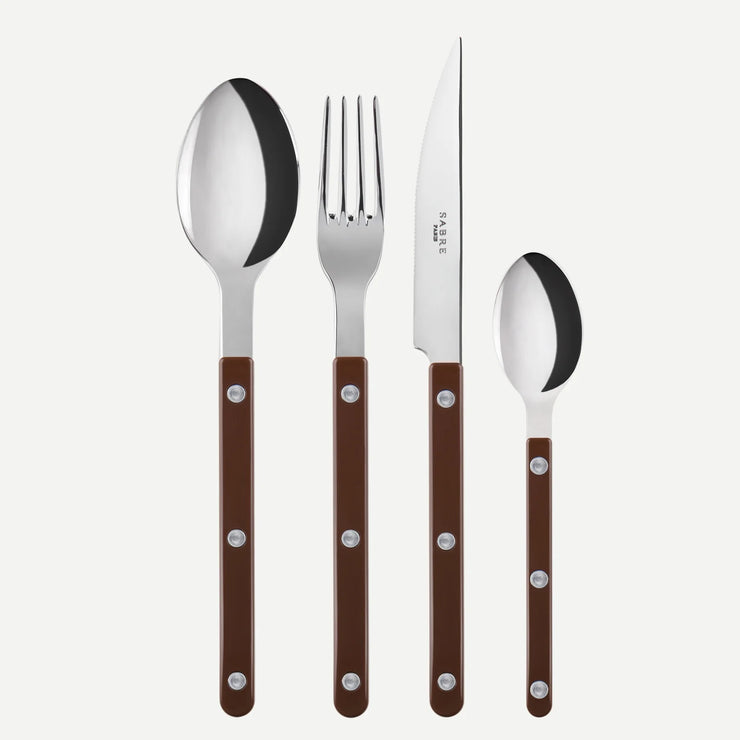 Bistrot Solid 4-piece cutlery set in Chocolate by Sabre Paris, featuring a knife, fork, spoon, and teaspoon with rich brown handles and polished stainless steel tops.