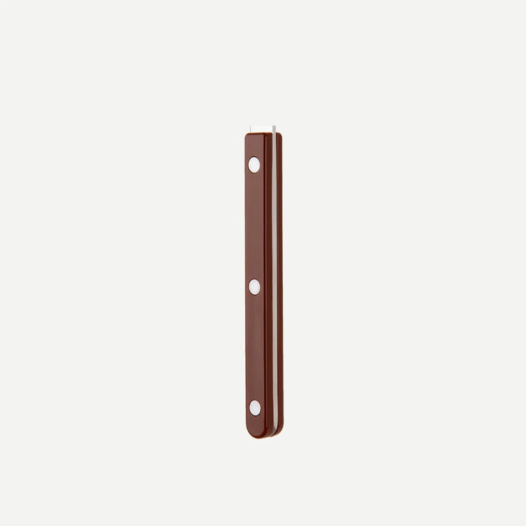 Close-up of the chocolate-coloured handle from the Bistrot Solid cutlery range by Sabre Paris, showcasing its riveted design and sleek finish.