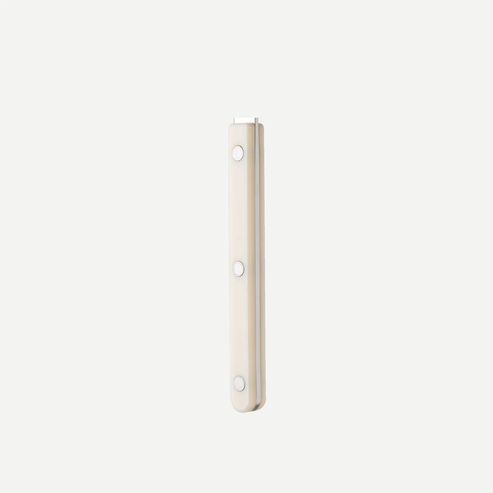Close-up of the Sabre Paris Bistrot Solid handle in Ivory, showcasing its glossy finish and precise riveted detailing.