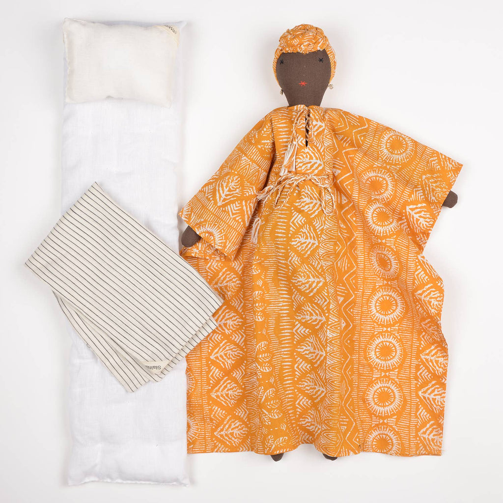Soumba doll by SilaiWali displayed with bedding accessories, highlighting its handcrafted design.