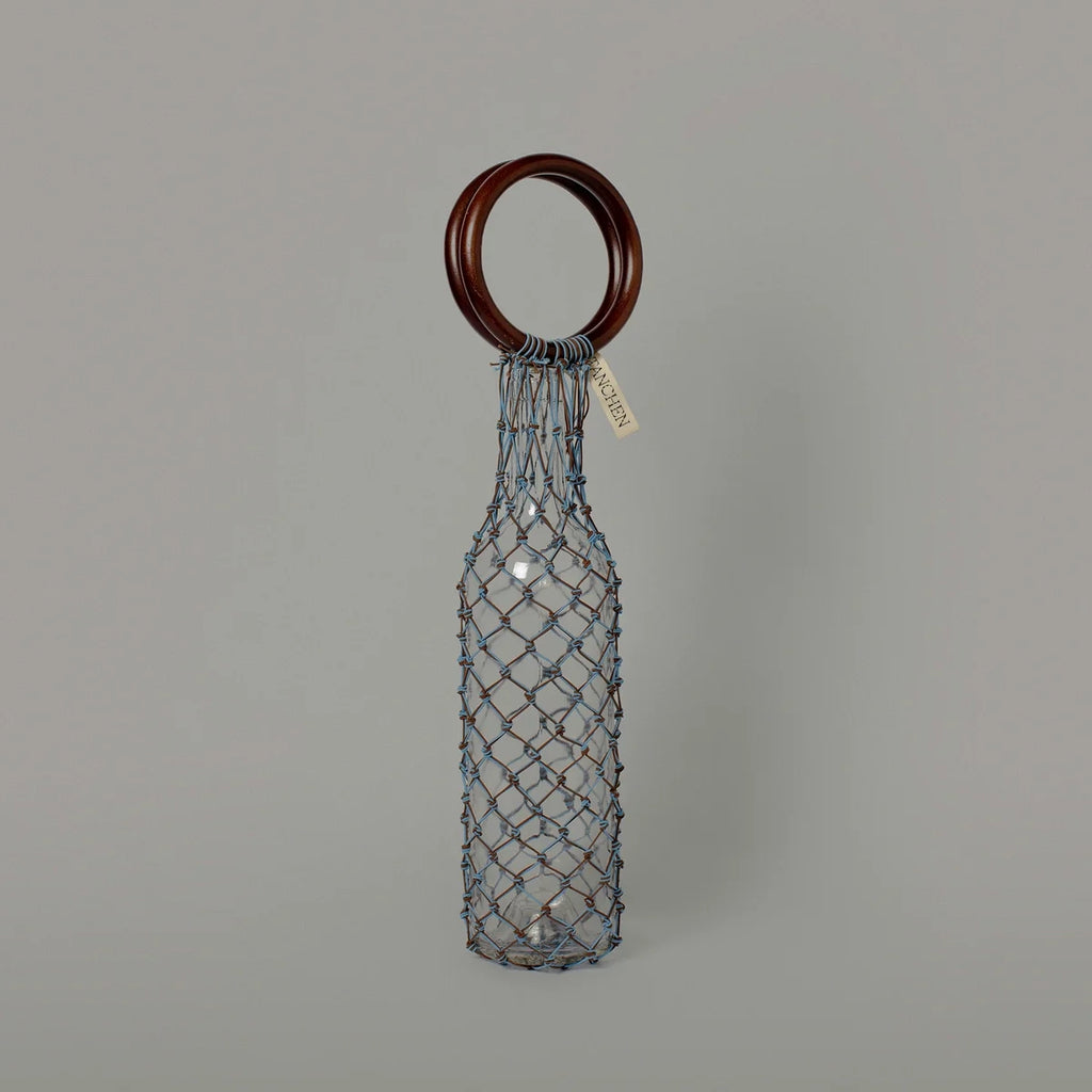 Front view of the 00 Bag in Blue Brown by Tanchen, showcasing a unique design with a blue-brown netting and wooden rings.