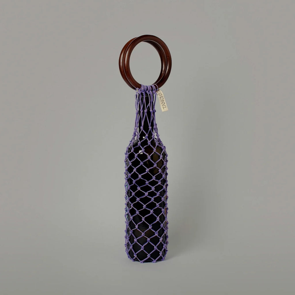 Front view of the 0/0 Bag in Purple Lilac by Tanchen, showcasing the intricate purple netting with a wooden ring handle.