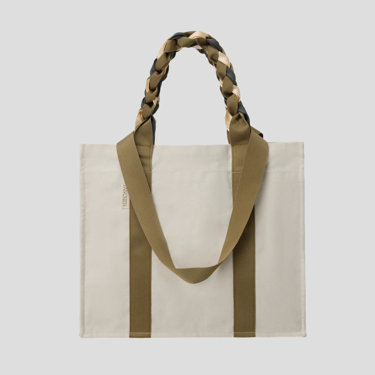 Front view of the Cream and Tan Picnic Bag Fizz! by Tanchen, showcasing its cotton canvas design with braided nylon ribbon handles.