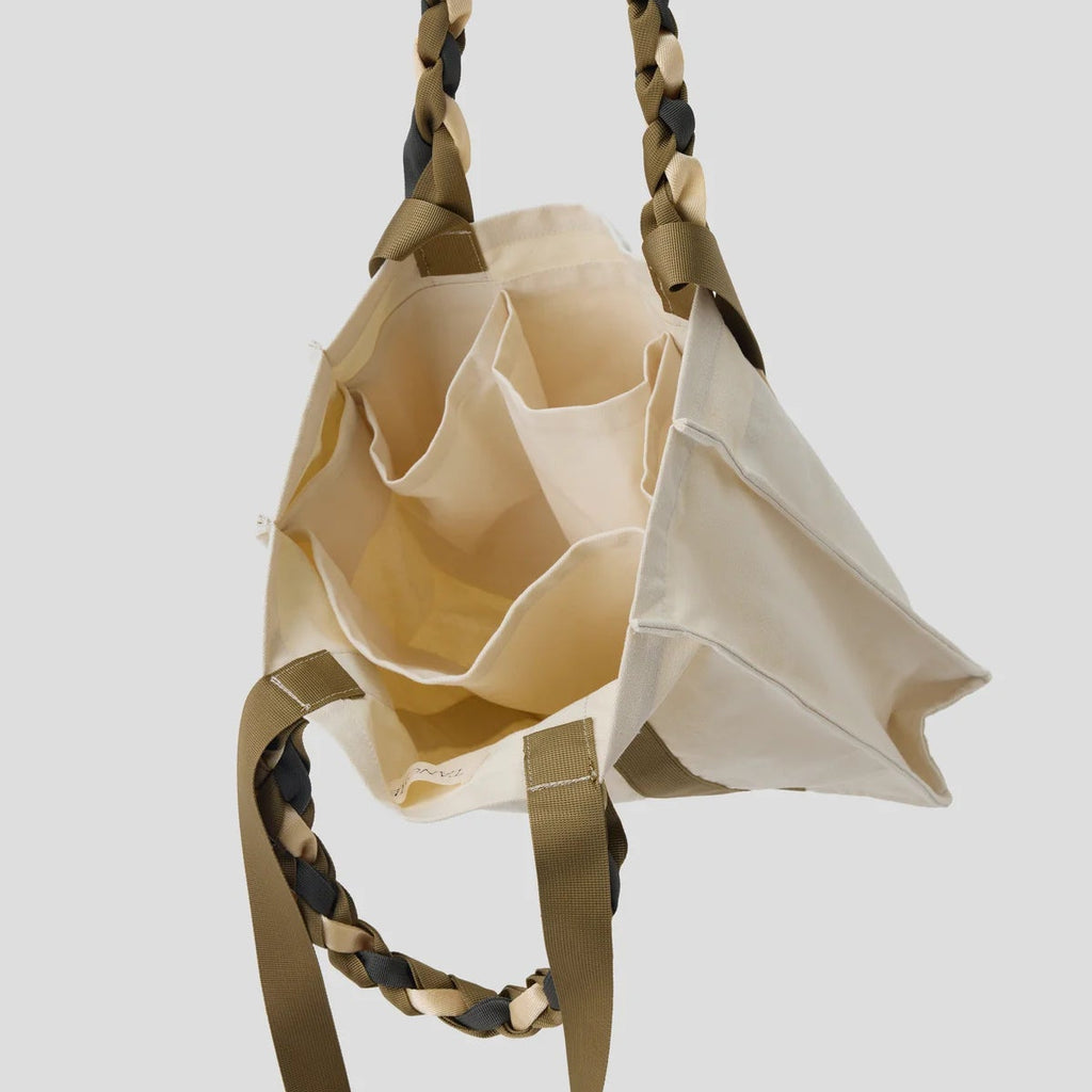 Interior view of the Cream and Tan Picnic Bag Fizz! by Tanchen, featuring multiple compartments for organised storage.