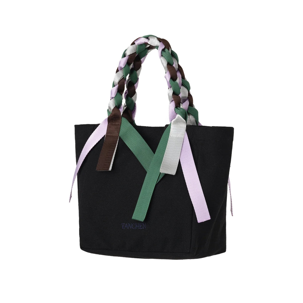 Side view of the Picnic Bag Mini Shrub by Tanchen, showcasing its elegant shape and bold ribbon accents in vibrant colours.