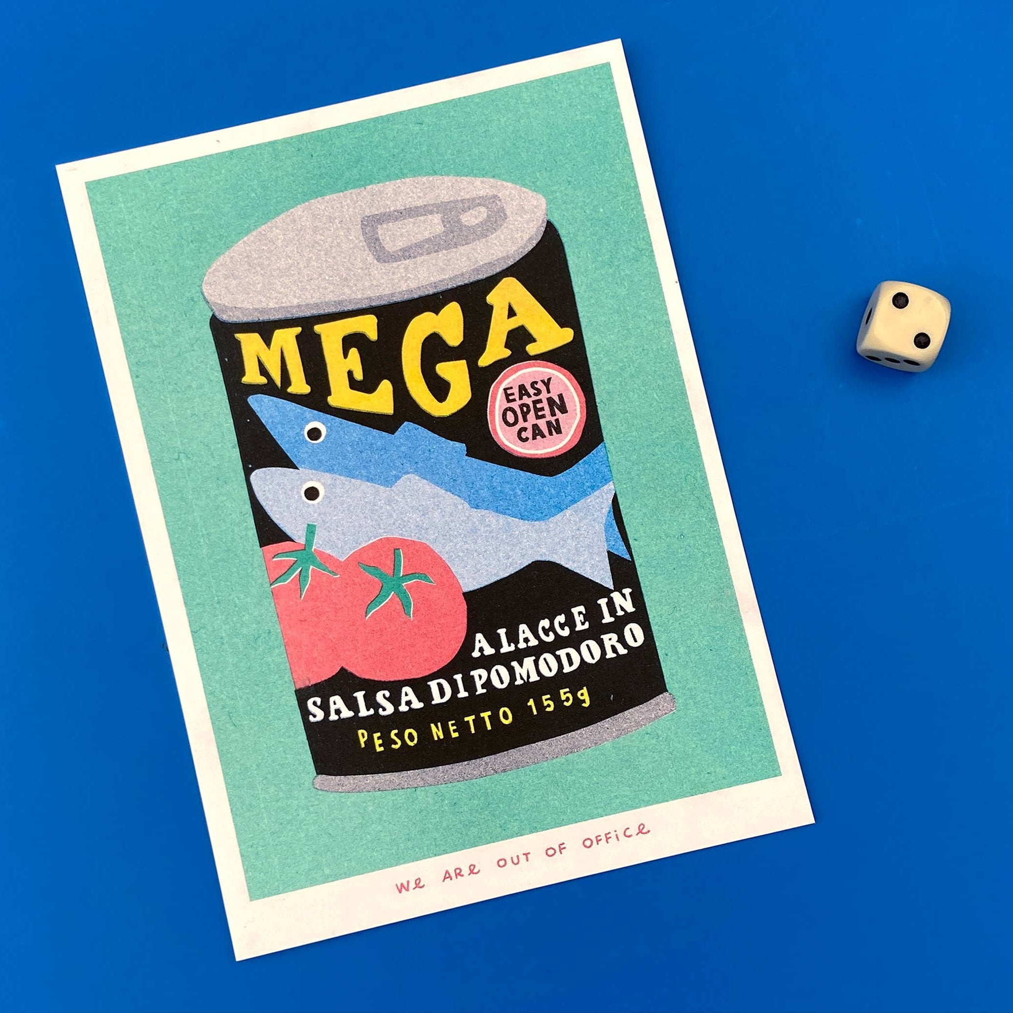 We Are Out Of Office Mega Sardines Risograph print displayed with a dice as a prop on a vibrant blue background.